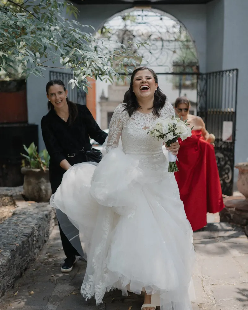 Cinthya and Ricardo walking out on their wedding day